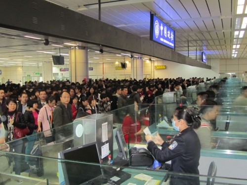 Travelers crossing from Hong Kong to Shenzhen at Shenzen Huanggang Border