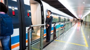 A female train conductor waiting before boarding on a train in China