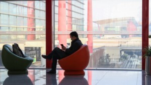 Man At The Airport Arrival Hall With Cell